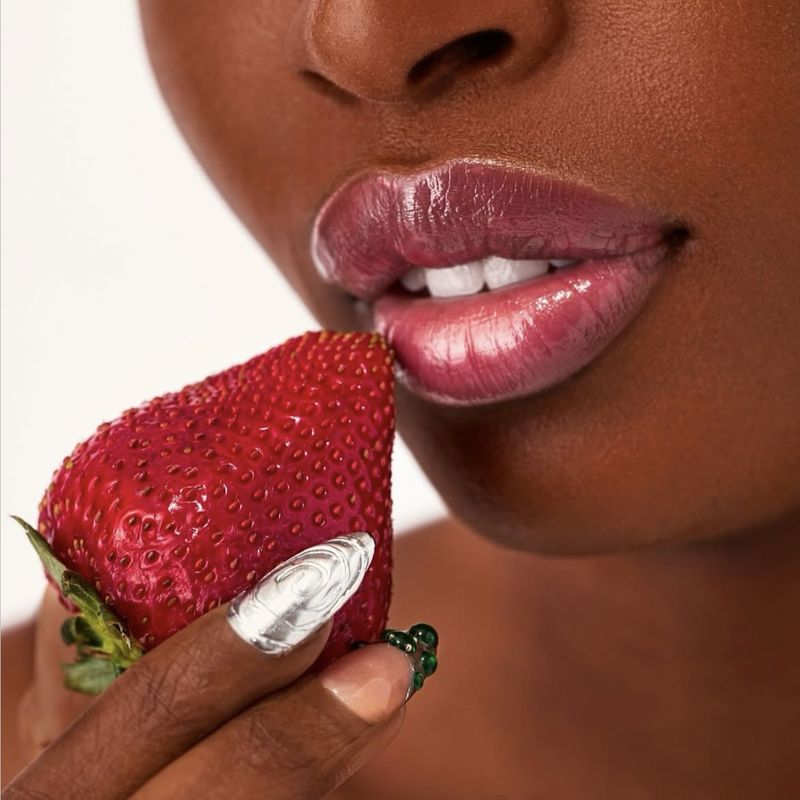 Beauty close-up — lip product with strawberry